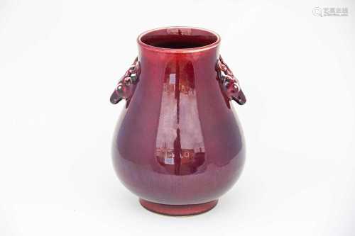 A good Chinese sang de boeuf vase, Qing, the Hu body with two deer handles and under a rich red