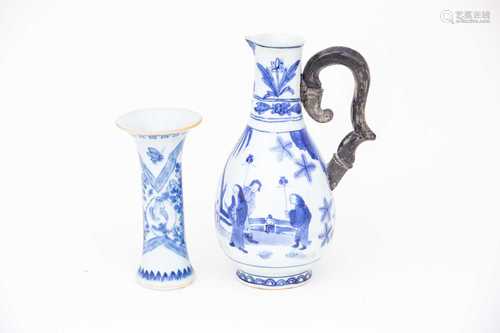 An interesting Japanese 'Transitional' ewer, circa 1660, painted in underglaze blue with figures