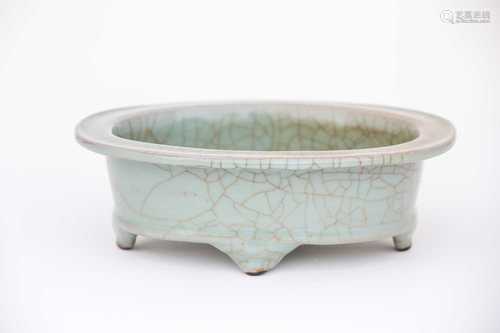 A Chinese celadon jardiniere, 20th century, the flat rim and deep well with a grey/green glaze