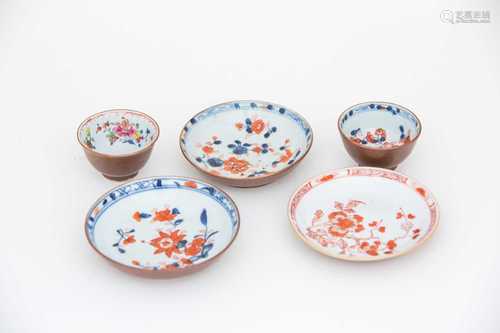 Two Chinese Batavian market tea bowls and three saucers, 18th century, one tea bowl decorated in