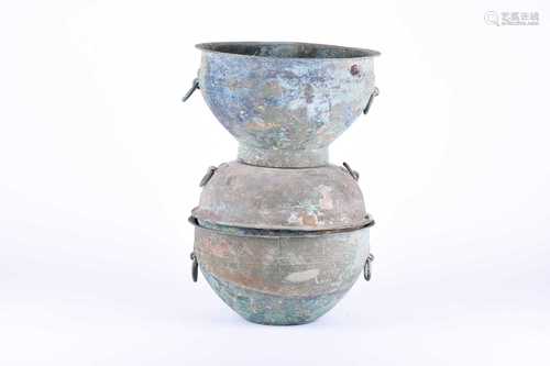 A large Chinese bronze steamer, Xian, Han Dynasty (206BC - 220AD), the upper bowl with an everted