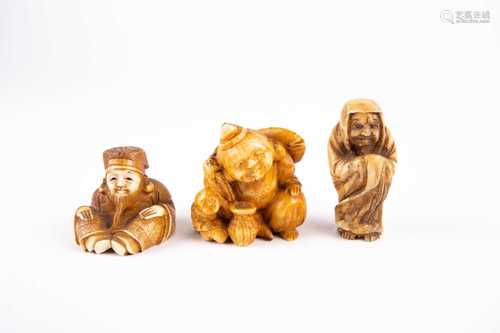 Three Japanese ivory netsukes, 19th century, comprising Daruma, Jurojin and Ebisu, all signed,