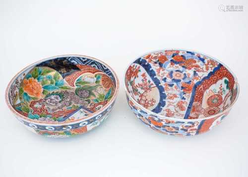 A Japanese Arita Imari bowl, 18th/19th century, painted with shishi amongst peony beside a panel