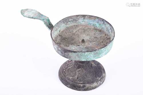 A Chinese bronze lamp. Han Dynasty (206 BC - 220 AD), the pan with raised sides and cental short