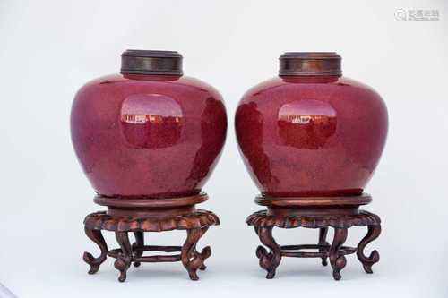 A pair of Chinese sang de boeuf vases, 19th century, the bulbous tapering vases wit a uniform red