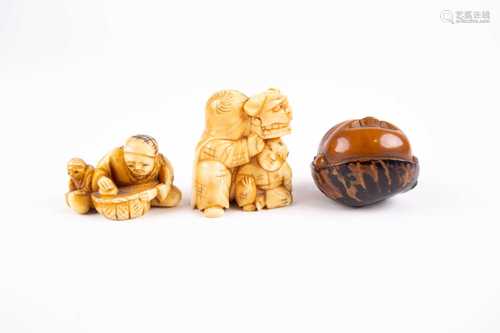 Two Japanese netsuke and an okimono, Meiji/Taisho period, comprising a Koroso nut carved as