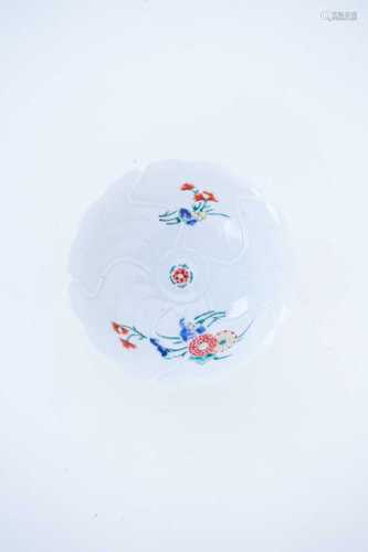 A Kakiemon porcelain bowl, circa 1850, lotus moulded and enamelled with stylised chrysanthemums