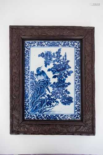 A Chinese porcelain blue & white plaque, 19th century, painted with a bird upon a rocky outcrop