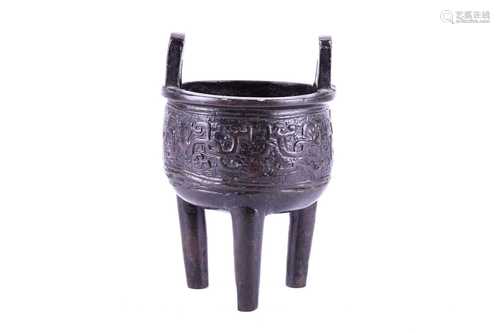 A Chinese bronze incense burner, Song dynasty, with rectangular loop handles, the body cast with