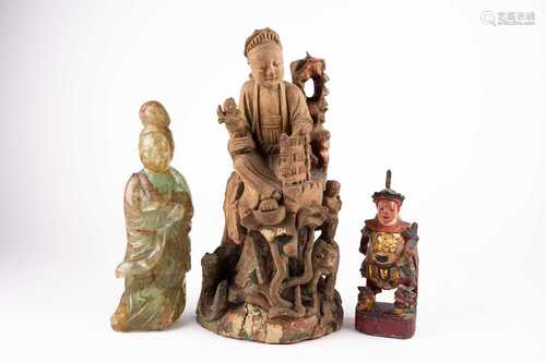 A Chinese carved wood figure, 19th century, the female seated on a highed fenced rock, a child on