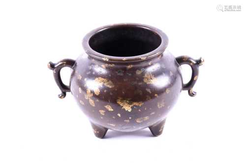 A Chinese bronze gold splash incense burner, with slightly everted rim above a spherical body with