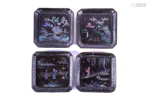 Four Chinese Lac Burgaute square dishes, probably 18th century, each depicting figures in garden