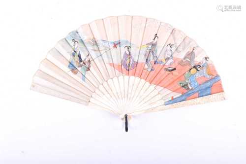 A carved ivory Japanese silk fan, Meiji period, painted with figures at a picnic beside a lake,