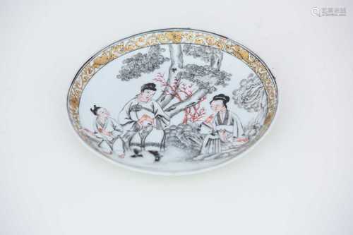 A good Chinese export saucer, circa 1740, pencilled en grisaille with a seated maiden, a man and boy