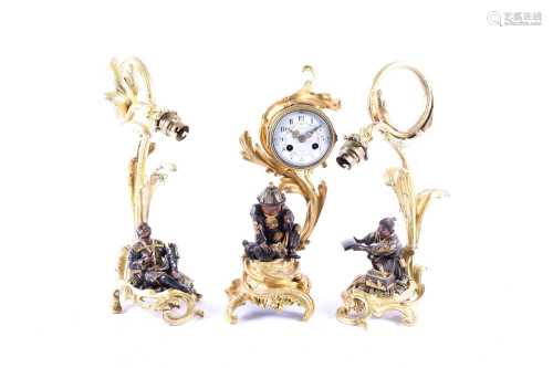 A 19th century French ormolu clock garniture with Japanese bronze figures, one of which signed