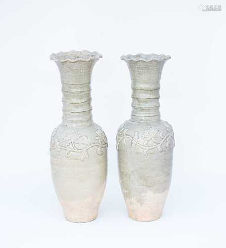 Two Chinese celadon funerary vases, one dated 1404, each with elongated ovoid body, engraved with