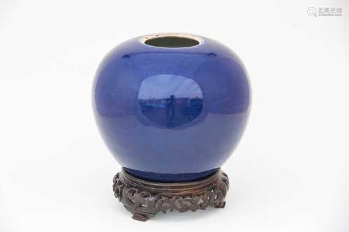 A Chinese powder blue ginger jar, 18th century, of spherical tapering form, raised on a carved