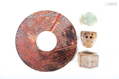 Four Chinese jades, Neolithic, Shang and Han dynasties, comprising a chicken bone Tsun, engraved