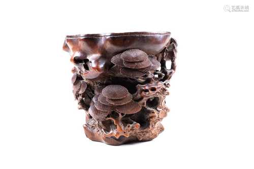 A good Chinese carved bamboo brush pot, Ming dynasty, carved and pierced as a rhinoceros horn