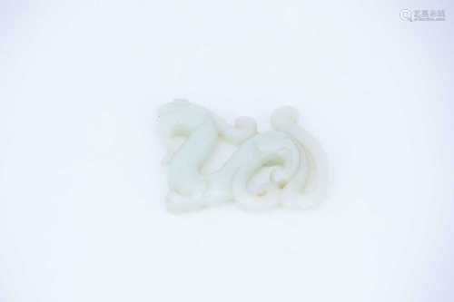 A Chinese carved jade archaic dragon, the stone a uniform colour throughout, 7cm long, 5.5cm