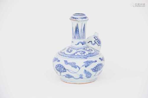 A Chinese blue & white Kendi, 17th century, the neck with pointed stiff leaves above a scrolling