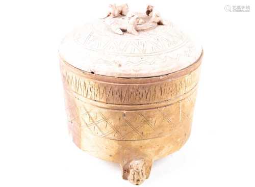 A wide bodied cylindrical jar and cover, Han dynasty, incised with diamonds and spearheads, the