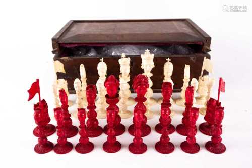 A rare Chinese Canton carved natural and stained ivory figural chess set, 19th century, the white