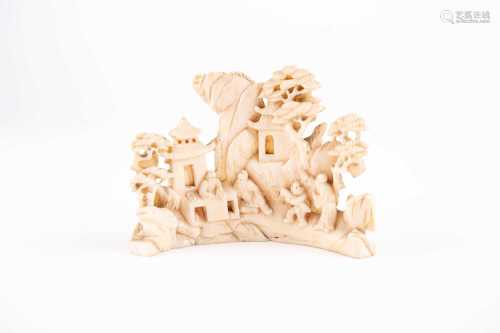 A Chinese carved ivory for the Scholars desk, 19th century, carved as scholars and a boy in a