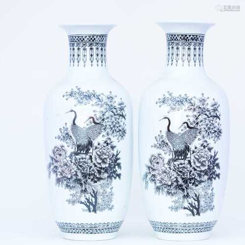 A pair of Chinese Peoples Republic porcelain vases, 20th century, the flared rim above a black