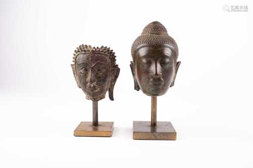 Two bronze busts of Buddha, 18th/19th century, on square metal bases, 12cm 15cm