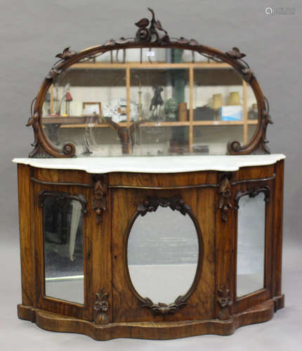 A late Victorian walnut mirror-back chiffonier with a white marble top above mirrored cupboard