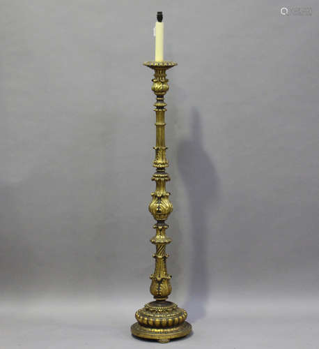 An early 20th century Continental carved giltwood lamp standard, worked with acanthus leaf knops,