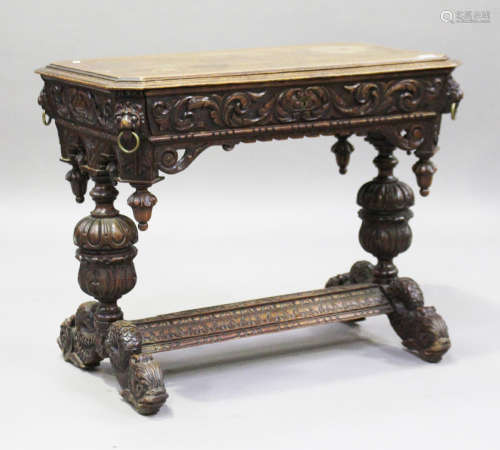 A Victorian Baroque Revival carved oak centre table, fitted with a single frieze drawer, raised on