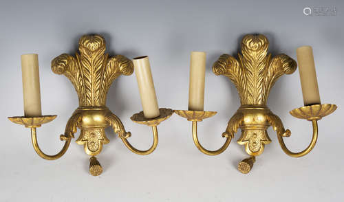 A set of six early/mid-20th century carved giltwood twin-light wall sconces with Prince of Wales