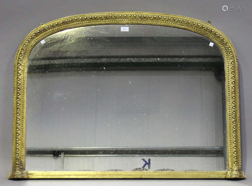 A Victorian giltwood arched overmantel mirror, decorated with a beaded and stiff leaf band, 83cm x