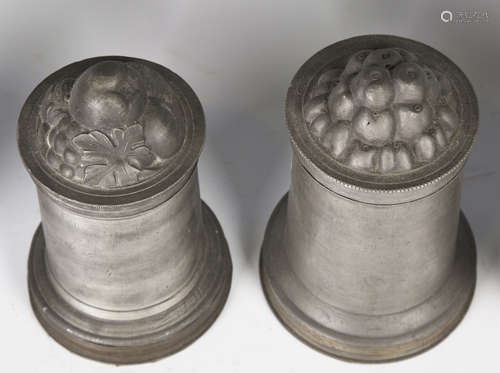 A collection of 19th and 20th century pewter items, including two Victorian aspic jelly moulds,