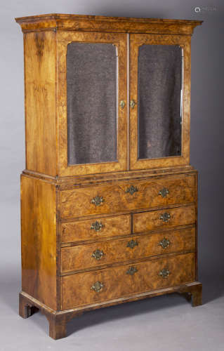 A George I walnut secrétaire cabinet, in the manner of William Old and John Ody, the cavetto moulded
