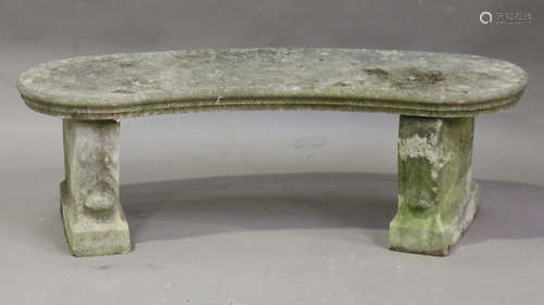 A 20th century cast composition stone garden seat, the curved top on a pair of acanthus leaf