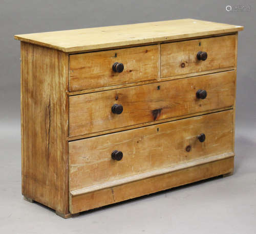 A 19th century pine chest of two short and two long drawers, height 88cm, width 127cm, depth 45cm.