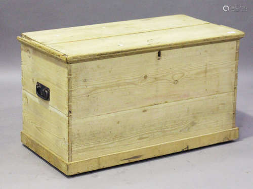 A 19th century pine trunk, fitted with a hinged lid, height 60cm, width 102cm, depth 53cm (faults).