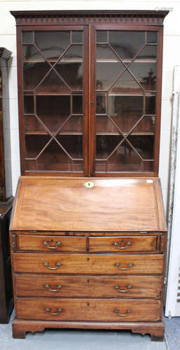 A George III mahogany bureau bookcase, the fall-flap enclosing a fitted interior, height 216cm,