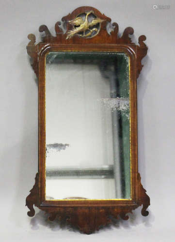 A 19th century George III style mahogany fretwork framed wall mirror with carved and gilded