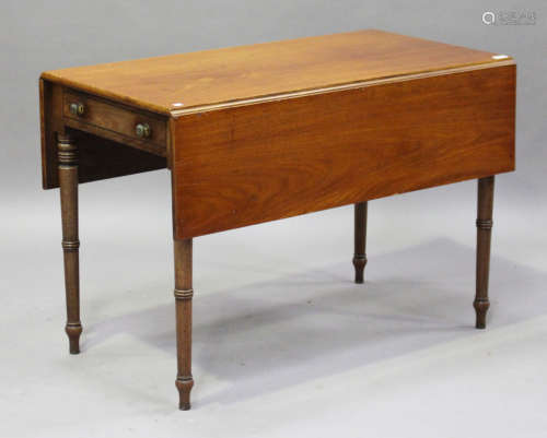 A Regency mahogany Pembroke table, the frieze with a single drawer, raised on ring turned legs,