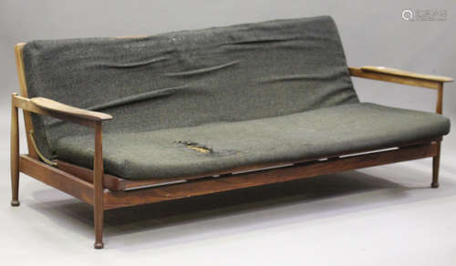 A mid-20th century Danish hardwood folding day bed, in the manner of Finn Juhl, the shaped arm