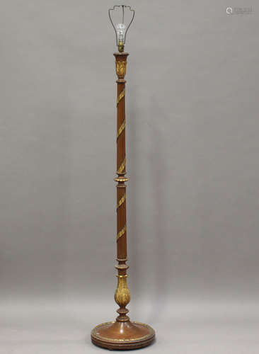 An early 20th century walnut and parcel gilt lamp standard, height 153cm.Buyer’s Premium 29.4% (