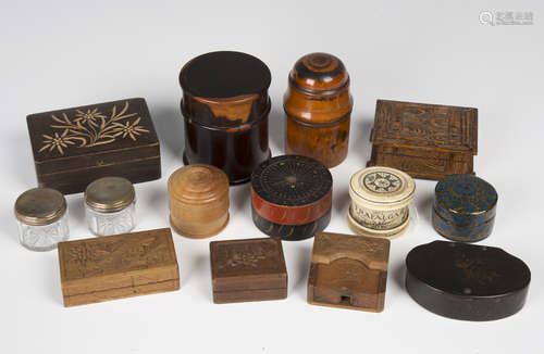 A collection of various boxes, including papier-mâché snuff boxes, turned treen vessel cases and a