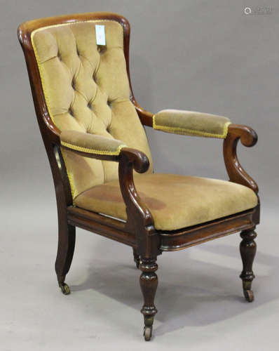 A mid-Victorian mahogany framed salon armchair, raised on 'Cope's Patent' brass caps and castors,