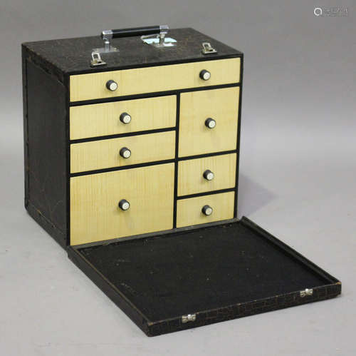 An Art Deco table-top needlework cabinet, the exterior with a crackle painted finish, enclosing