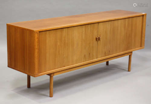 A mid-20th century Danish teak sideboard, designed by Jens Quistgaard for Peter Long, the two