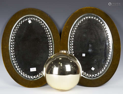 A pair of late Victorian oval facet cut wall mirrors, mounted on velvet backboards, 56cm x 40cm,